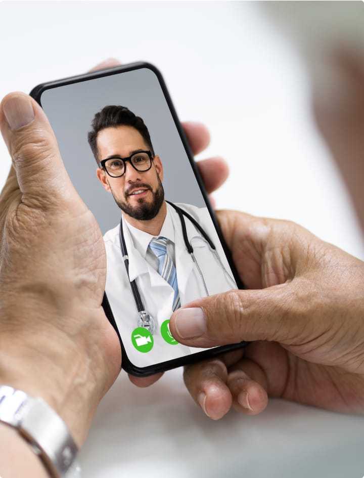 Doctor video chatting on mobile phone.