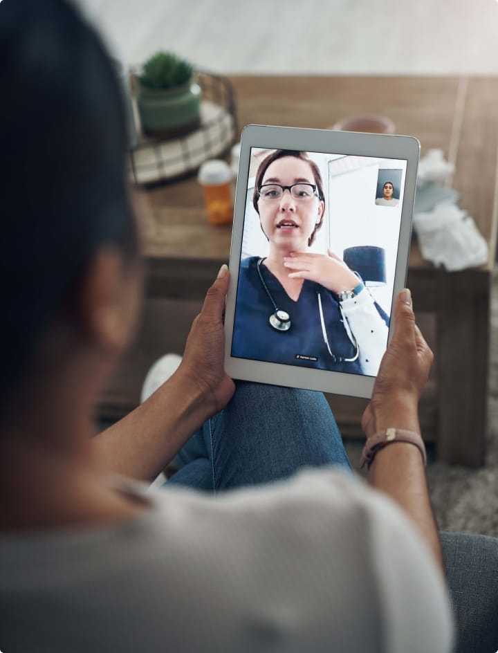 A Blue Cross Blue Shield of Rhode Island Care Manager having a video call on a tablet computer.